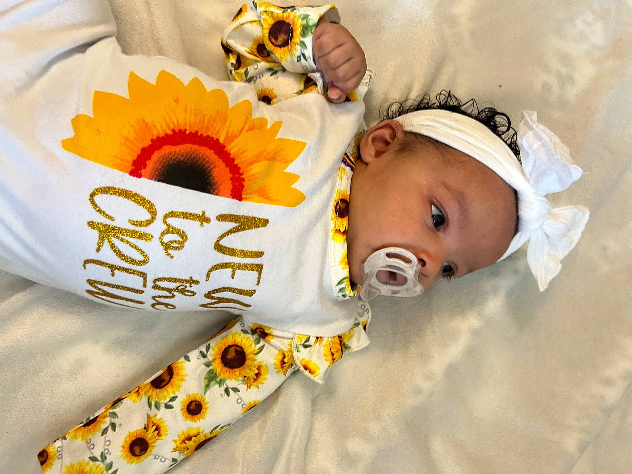 Kanylah is registered to the contest to win money with this photo: baby, baby_products, baby_safety, baby_sleeping, baby_toddler_clothing, child, comfort_food, eyelash, font, happy, linens, person, petal, product, room, sleeve, sunflower, toddler, yellow