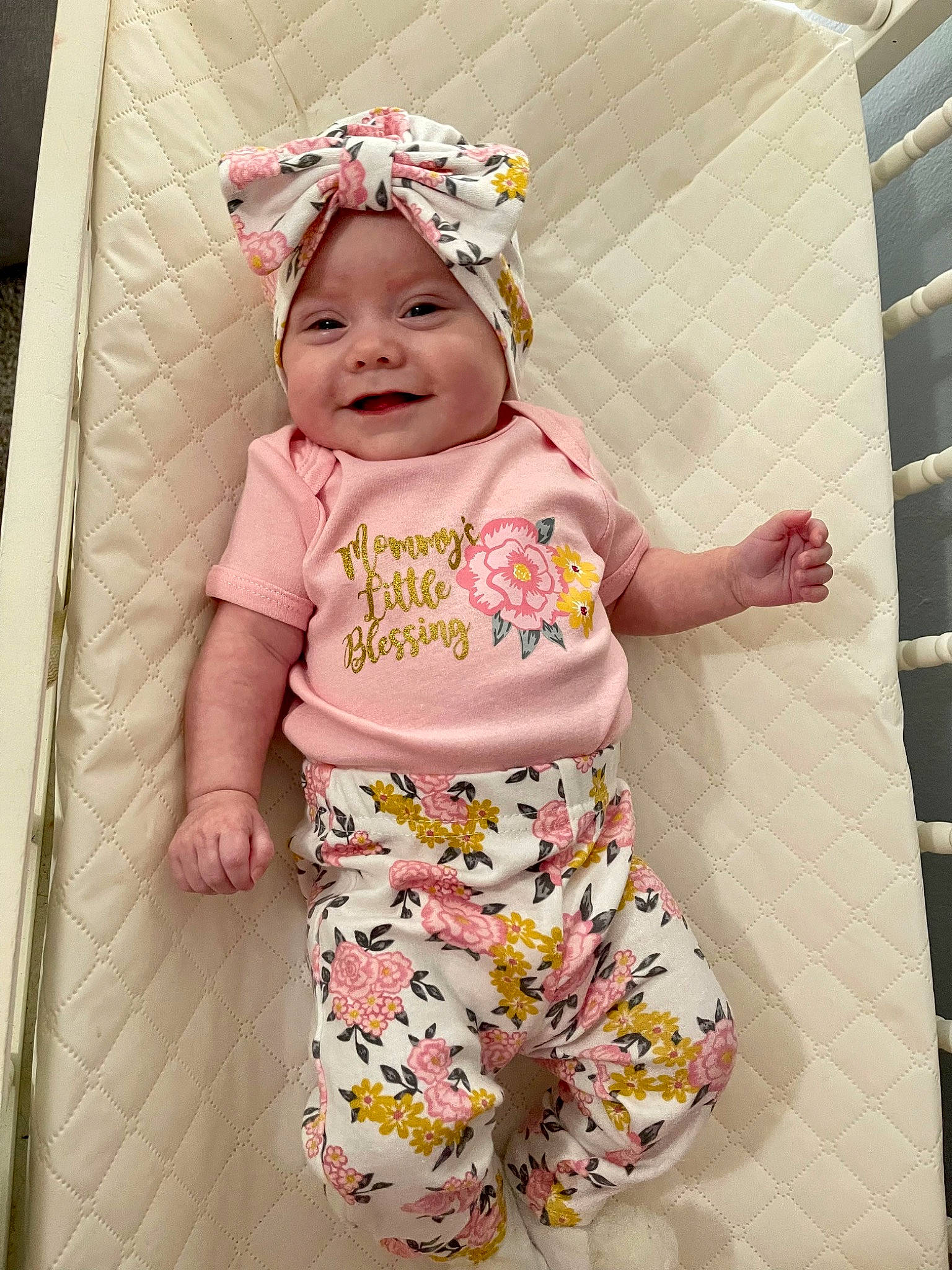 Emberlynn is registered to the contest to win money with this photo: baby, baby_laughing, baby_products, baby_safety, baby_sleeping, baby_toddler_clothing, child, comfort, fun, happy, headpiece, headwear, joy, linens, pattern, person, pink, play, room, sleeve