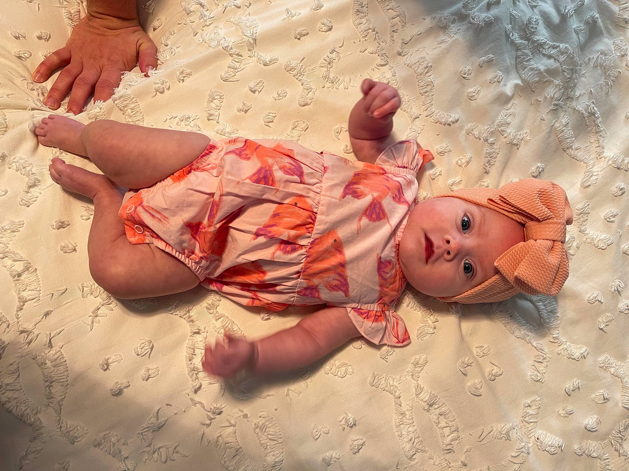 Emberlynn is registered to the contest to win money with this photo: baby, baby_toddler_clothing, barefoot, child, comfort, dress, finger, foot, fun, happy, headwear, human_body, human_leg, leg, pattern, person, pink, skin, textile, toddler
