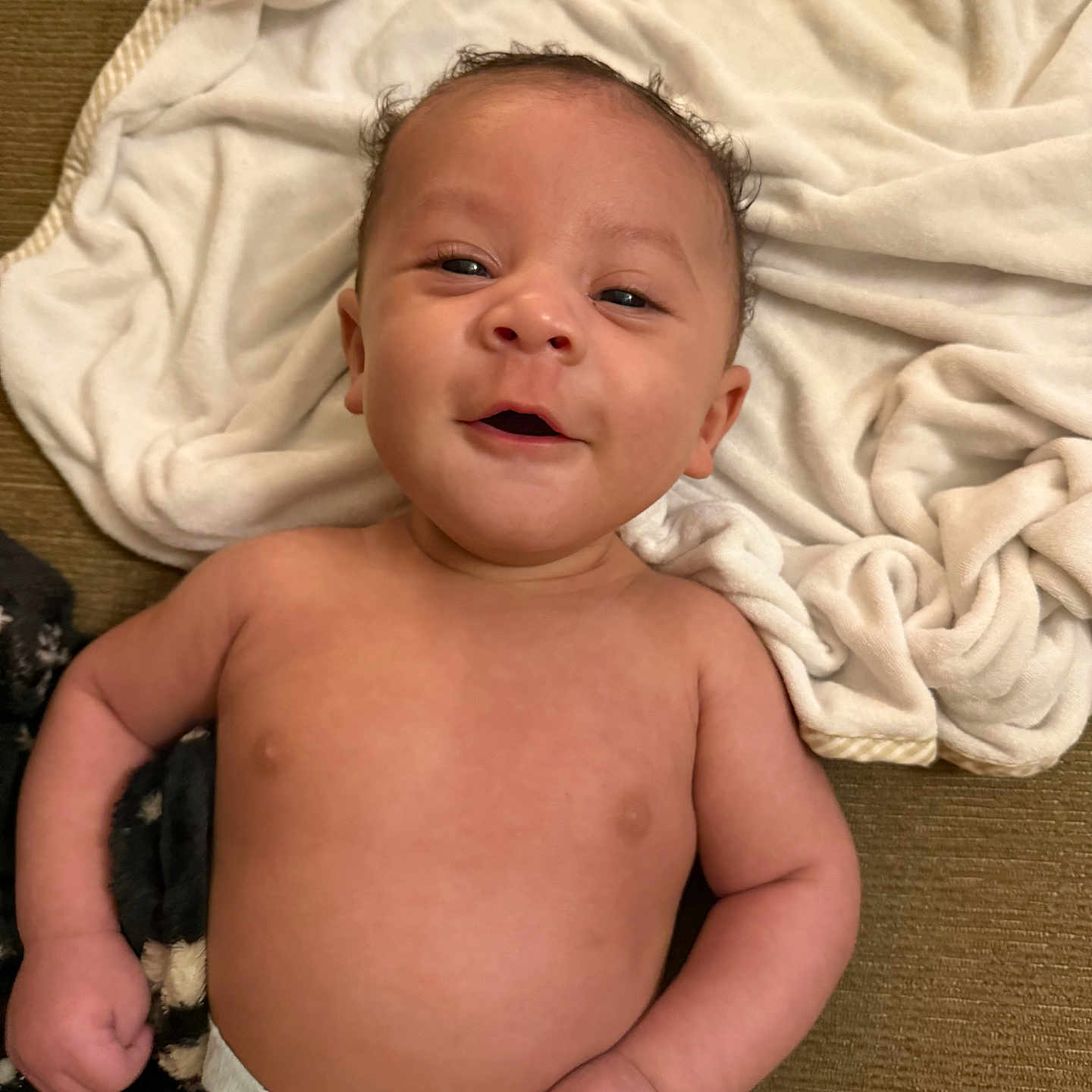 River joined the competition — help win amazing prizes! baby, blanket, bodypart, bonnet, clothing, cushion, diaper, face, finger, hand, happy, hat, head, homedecor, newborn, person, photography, portrait, smile, towel