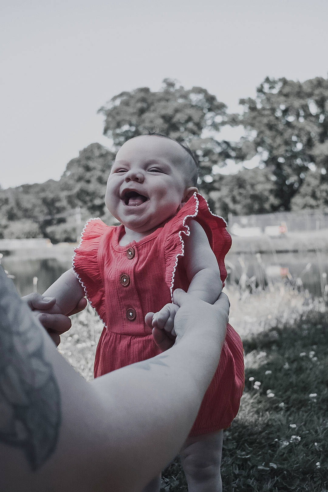 Braelynn is registered to the contest to win money with this photo: arm, baby, flash_photography, freezing, fun, gesture, grass, hand, happy, laugh, monochrome, monochrome_photography, people_in_nature, person, plant, sitting, sky, smile, style, toddler