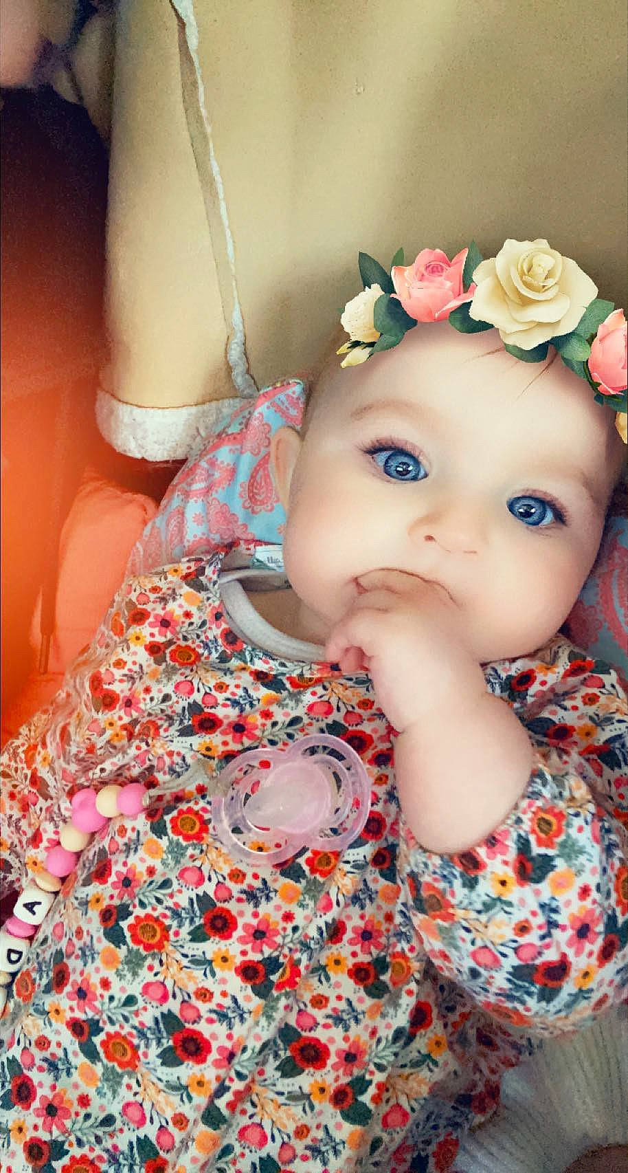 Adixia participe au concours pour gagner de l'argent avec cette photo : baby, baby_toddler_clothing, cap, cheek, dress, eye, flower, head, headband, headpiece, iris, lip, pattern, peach, person, petal, pink, skin, sleeve, textile
