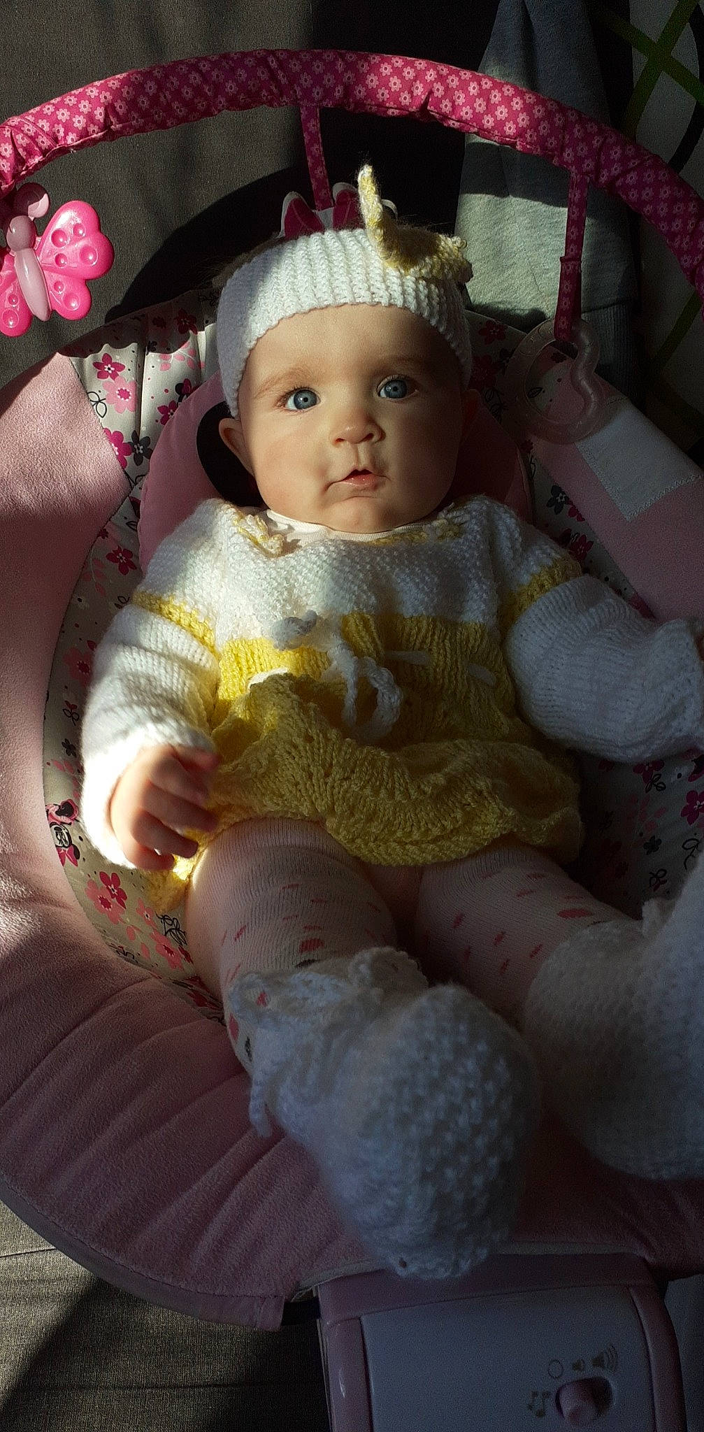 Adixia participe au concours pour gagner de l'argent avec cette photo : baby_toddler_clothing, cap, chair, cheek, child, comfort, costume_hat, doll, dress, eye, headgear, headwear, human_body, iris, lap, lip, person, pink, skin, thigh