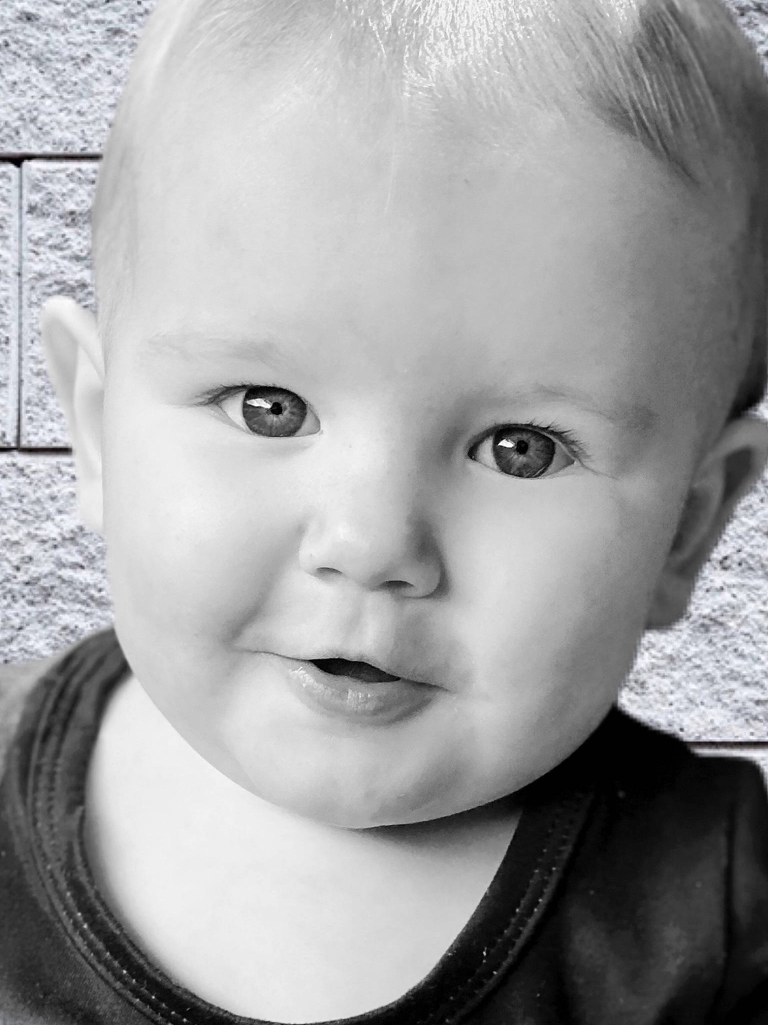 Bristol is registered to the contest to win money with this photo: baby, baby_toddler_clothing, black, cheek, chin, ear, eye, eyebrow, eyelash, flash_photography, forehead, iris, lip, mammal, mouth, neck, nose, person, photograph, skin