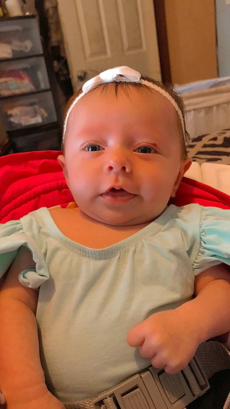 Adley is registered to the contest to win money with this photo: baby, baby_toddler_clothing, cheek, chin, ear, eye, eyelash, facial_expression, fun, hairstyle, happy, head, iris, lip, mouth, nose, organ, person, skin, sleeve