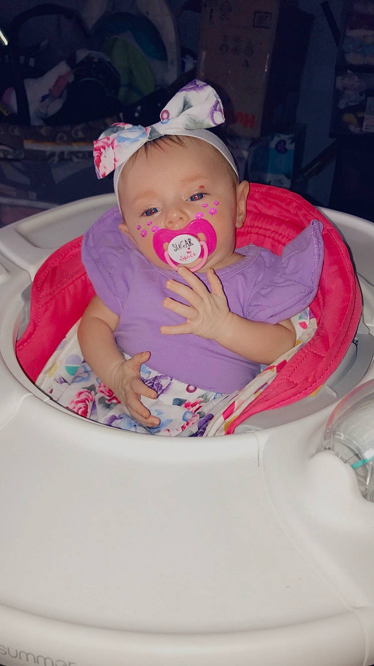Adley joined the competition — help win amazing prizes! baby, baby_carriage, baby_products, baby_toddler_clothing, bib, carmine, chair, cheek, child, comfort, facial_expression, fashion_accessory, fun, happy, hat, iris, mouth, person, pink, sitting