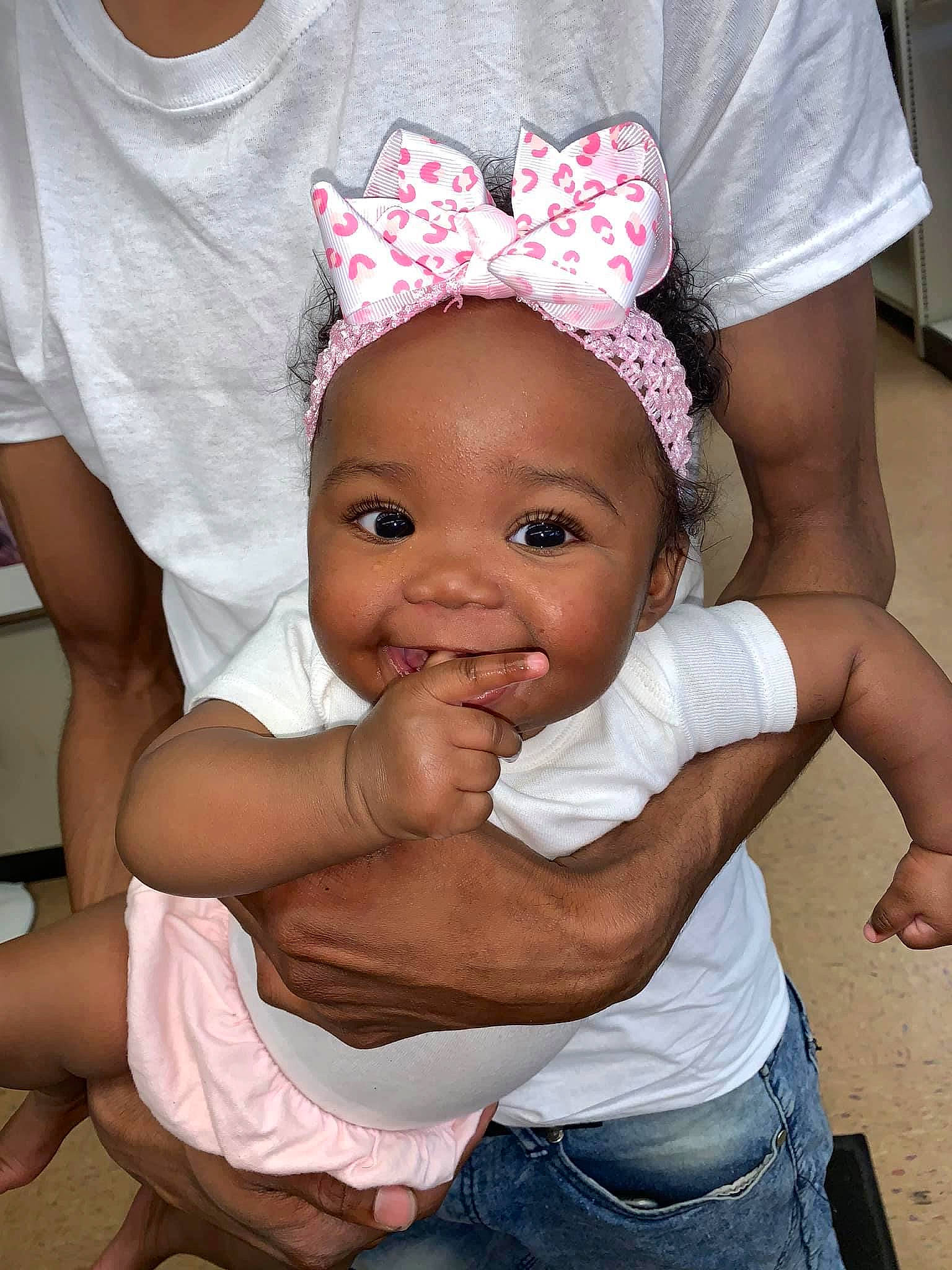 Kamiya is registered to the contest to win money with this photo: baby, baby_toddler_clothing, cap, child, costume_hat, event, fashion_accessory, fun, gesture, hair_accessory, happy, headpiece, jeans, magenta, person, pink, smile, thumb, toddler, tradition