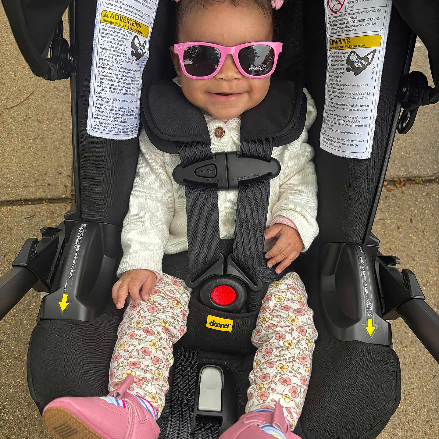 Kailani is registered to the contest to win money with this photo: accessories, baby, bodypart, car, car_interior, carseat, clothing, face, finger, footwear, glasses, hand, head, person, photography, portrait, shoe, sunglasses, transportation, vehicle