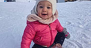 Lilou participe au concours pour gagner de l'argent avec cette photo : beanie, boots, child, cold_weather, happy, hat, infant_clothing, mittens, mountain, outdoors, pink_jacket, playful, portrait, sitting, ski_resort, smile, snow, snowy_landscape, toddler, winter