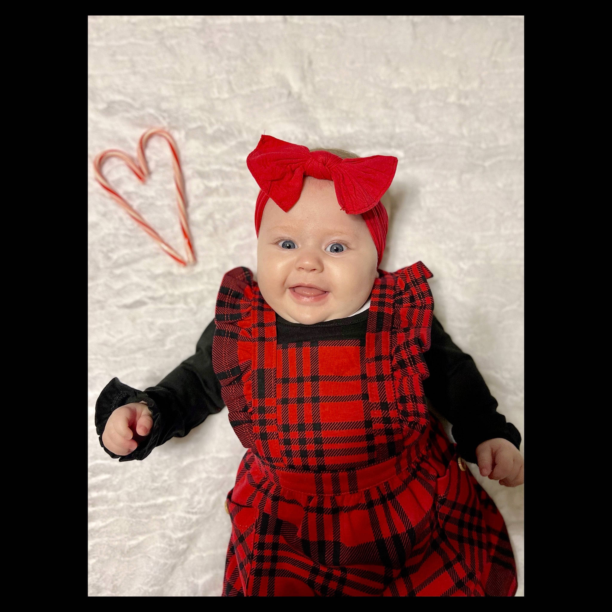 Bexleigh joined the competition — help win amazing prizes! baby, baby_toddler_clothing, carmine, child, collar, costume_hat, day_dress, dress, fur, happy, headwear, hood, magenta, one_piece_garment, pattern, person, plaid, sleeve, smile, tartan