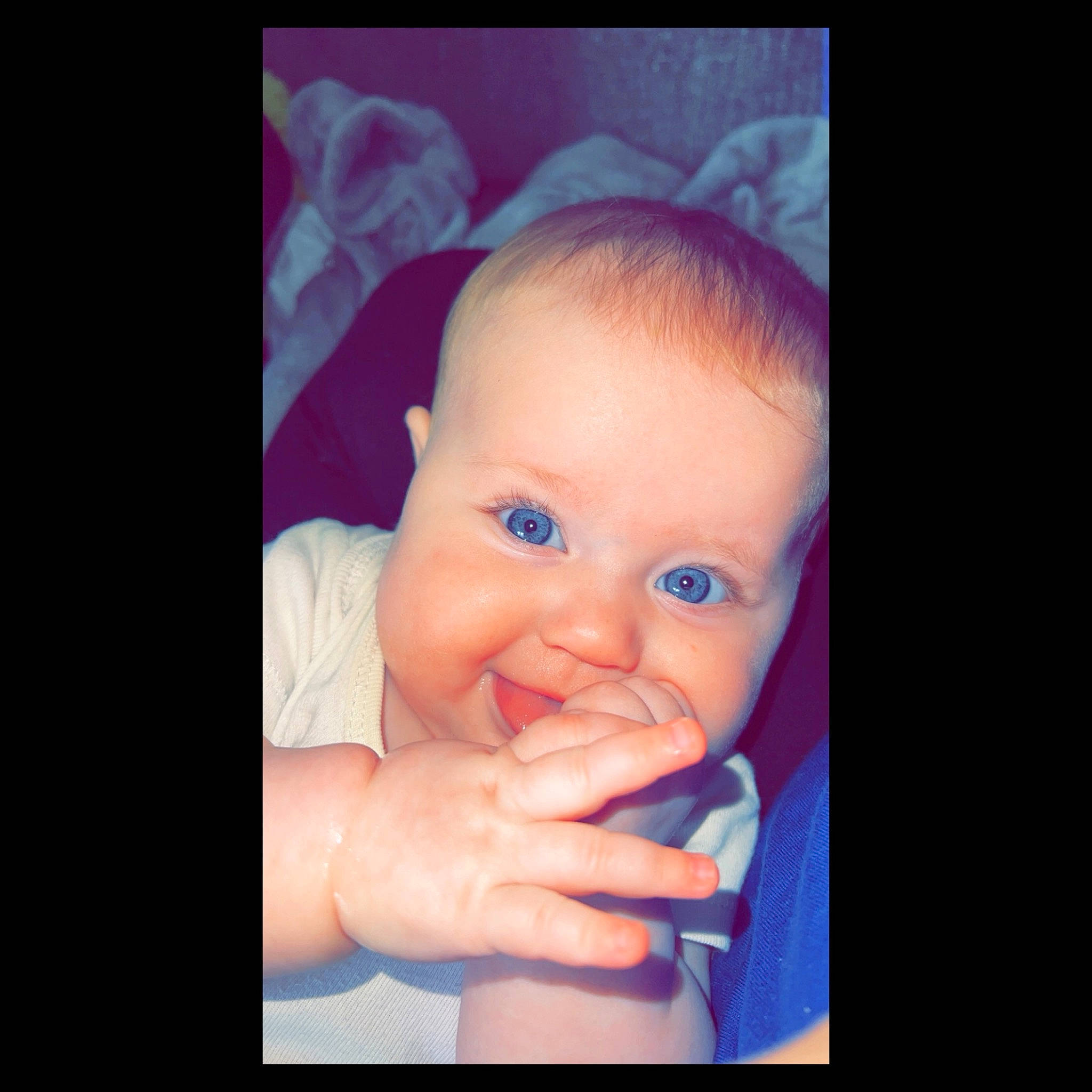 Bexleigh is registered to the contest to win money with this photo: arm, baby, baby_toddler_clothing, cheek, ear, eyebrow, eyelash, flash_photography, gesture, hand, happy, iris, jaw, lip, mouth, nose, person, purple, skin, smile