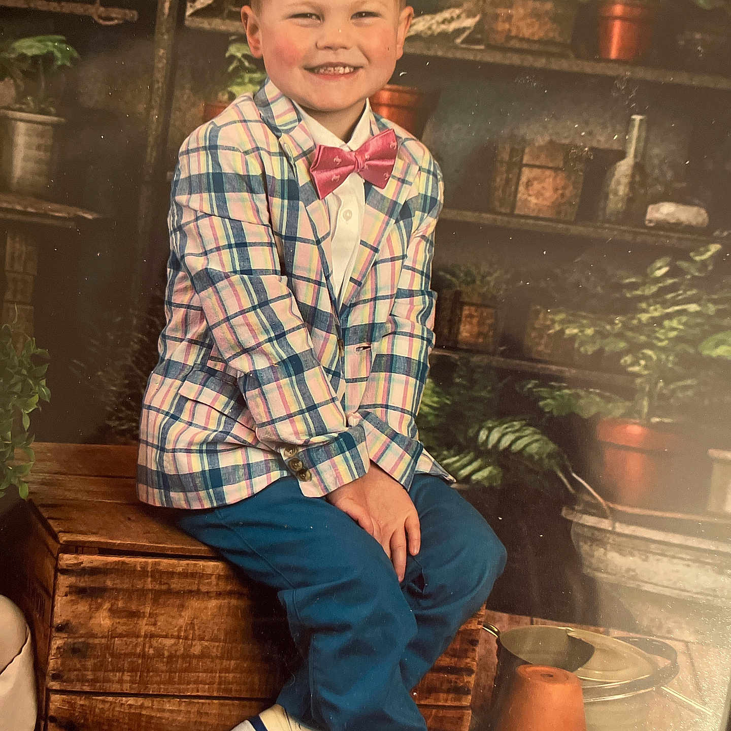 Kade is registered to the contest to win money with this photo: accessories, boy, child, clothing, face, footwear, formalwear, happy, head, jar, male, pants, person, photography, portrait, shirt, shoe, sitting, smile, tie
