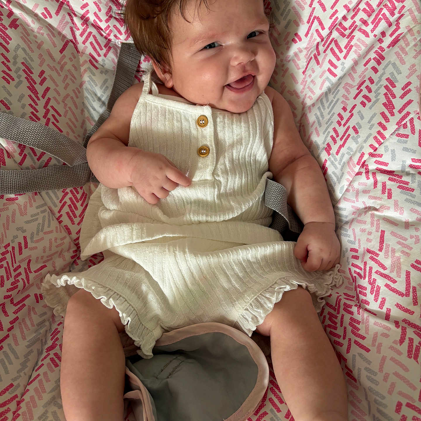 Alannahmae is registered to the contest to win money with this photo: baby, baby_girl, barefoot, buttoned_outfit, child, closeup, cute, face, hair, happy, indoors, infant, patterned_blanket, portrait, relaxed, sitting, skin, smiling, soft_lighting, white_clothing