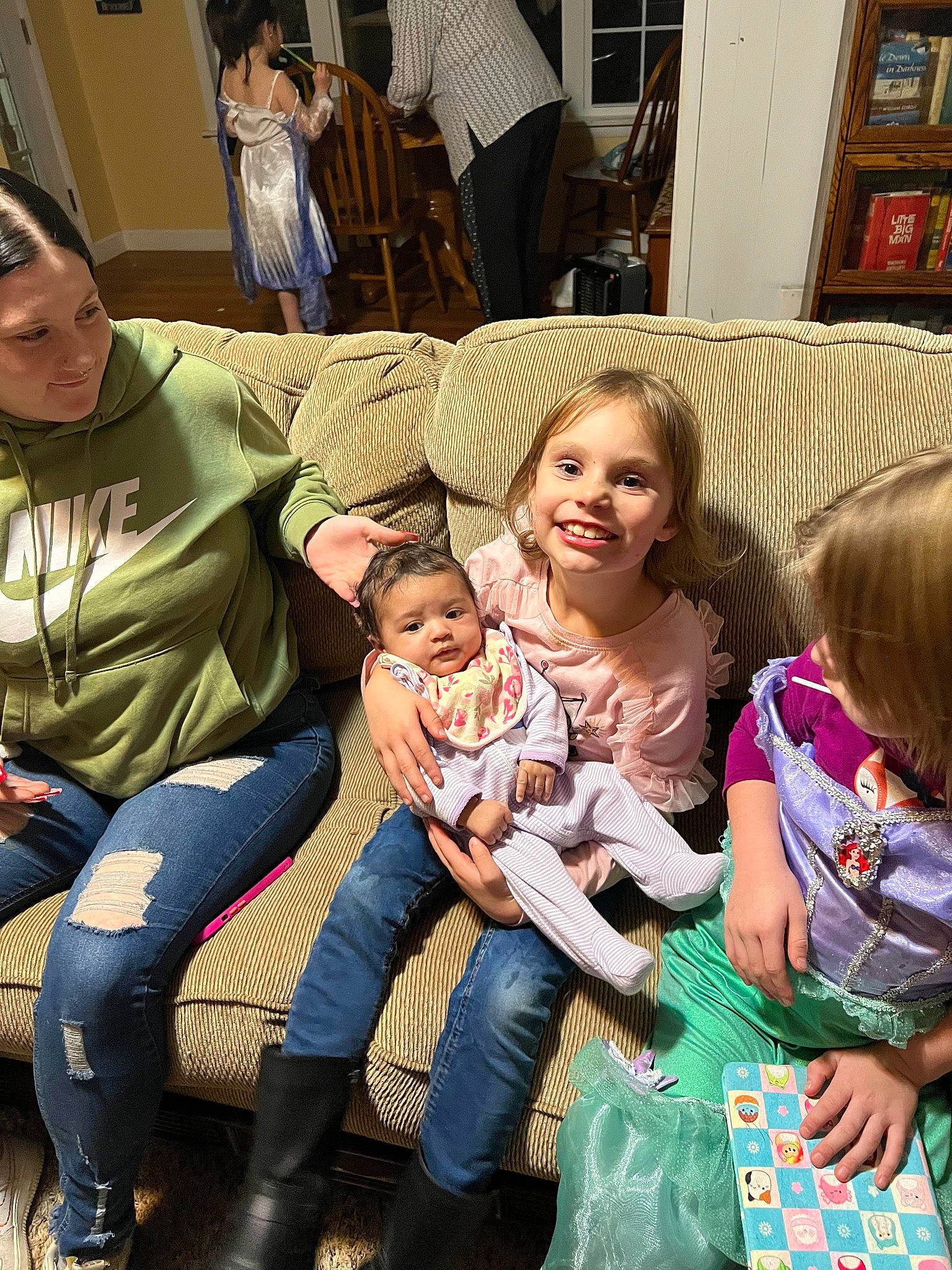 Katniss joined the competition — help win amazing prizes! baby, boot, child, comfort, couch, event, fun, happy, joy, lamp, lap, leg, leisure, person, picture_frame, sharing, sitting, skin, smile, thigh