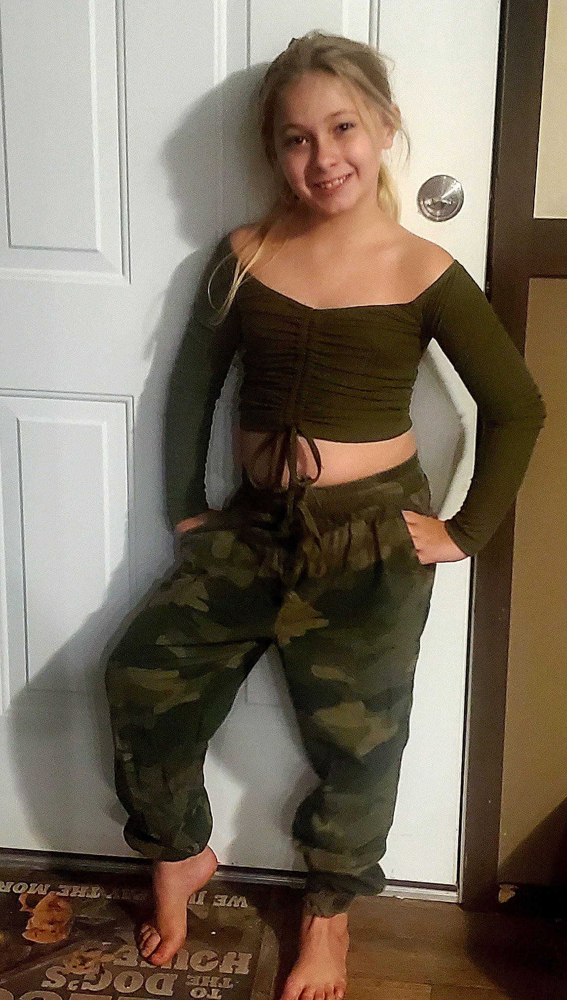 Megan joined the competition — help win amazing prizes! ballistic_vest, belt, camouflage, cargo_pants, chest, clothing, gesture, joint, joy, khaki, knee, leg, military_camouflage, military_uniform, neck, person, shoulder, sleeve, smile, thigh