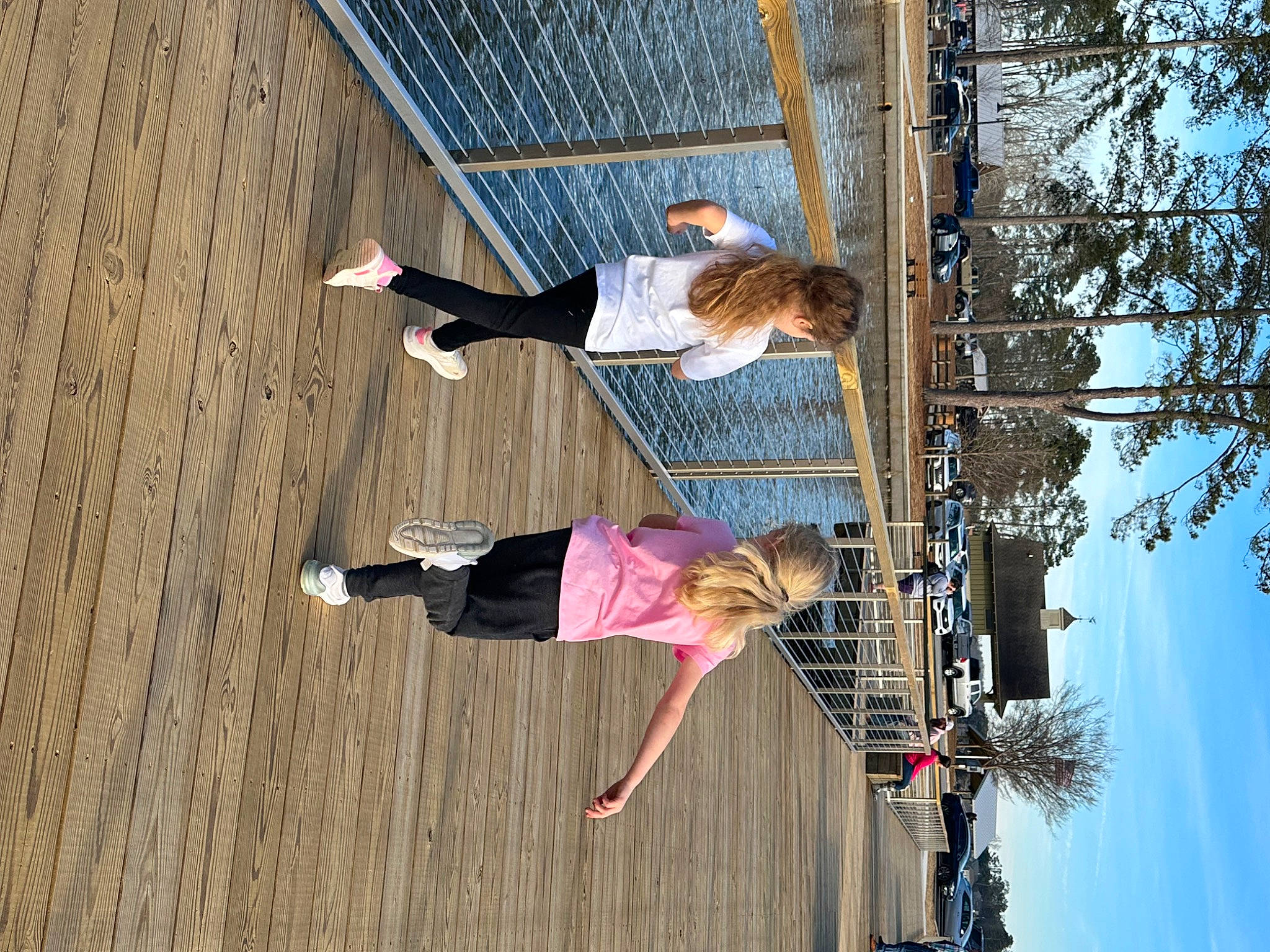 Brantley is registered to the contest to win money with this photo: facade, fun, hardwood, leisure, line, outdoor_shoe, person, plant, pole, sky, tree, waist, walking_shoe, wood