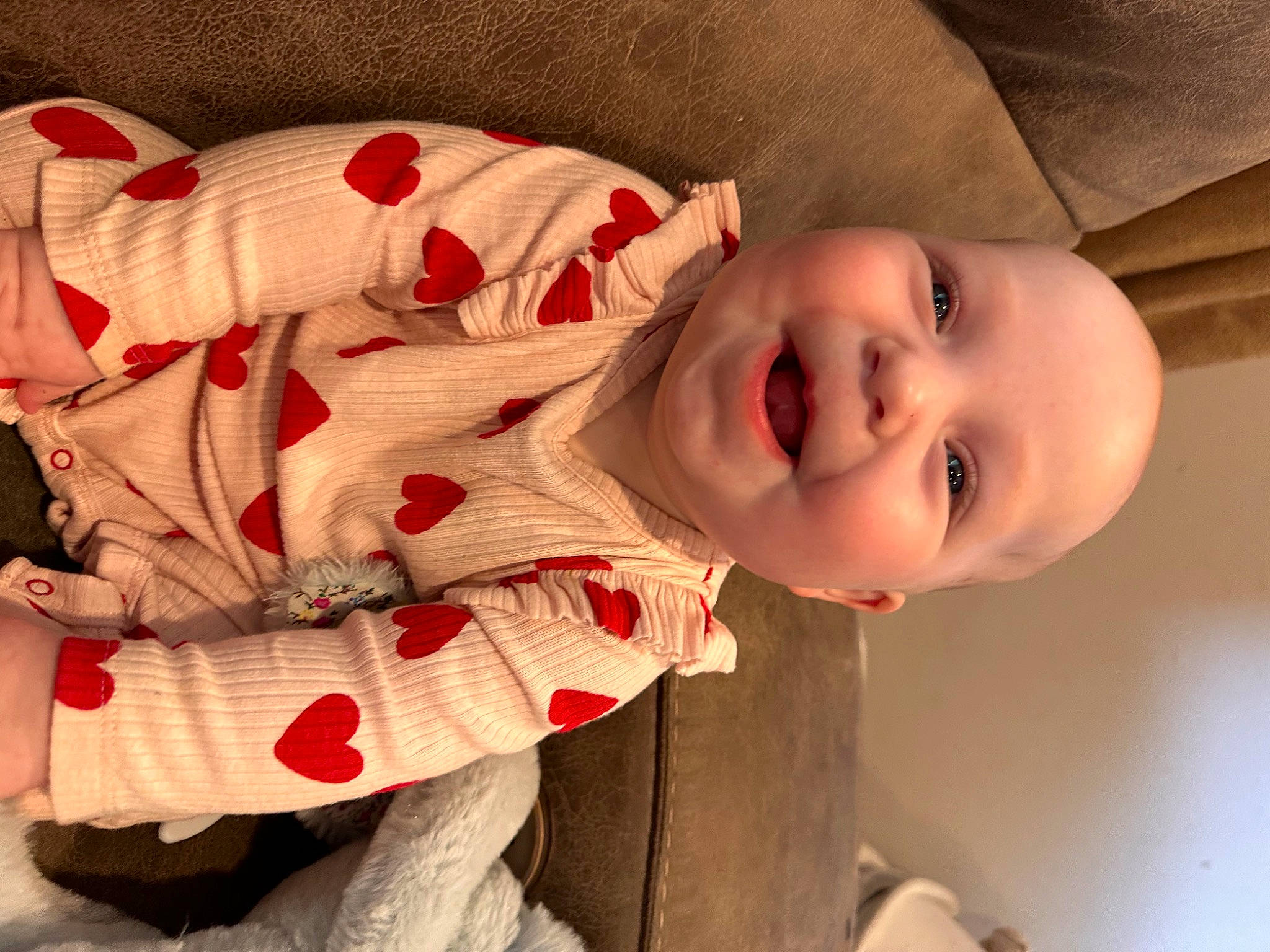 Cedar is registered to the contest to win money with this photo: baby_toddler_clothing, cheek, chin, clothing, eye, face, facial_expression, hand, happy, head, human_body, lip, mouth, nose, person, plant, skin, sleeve, smile, vertebrate