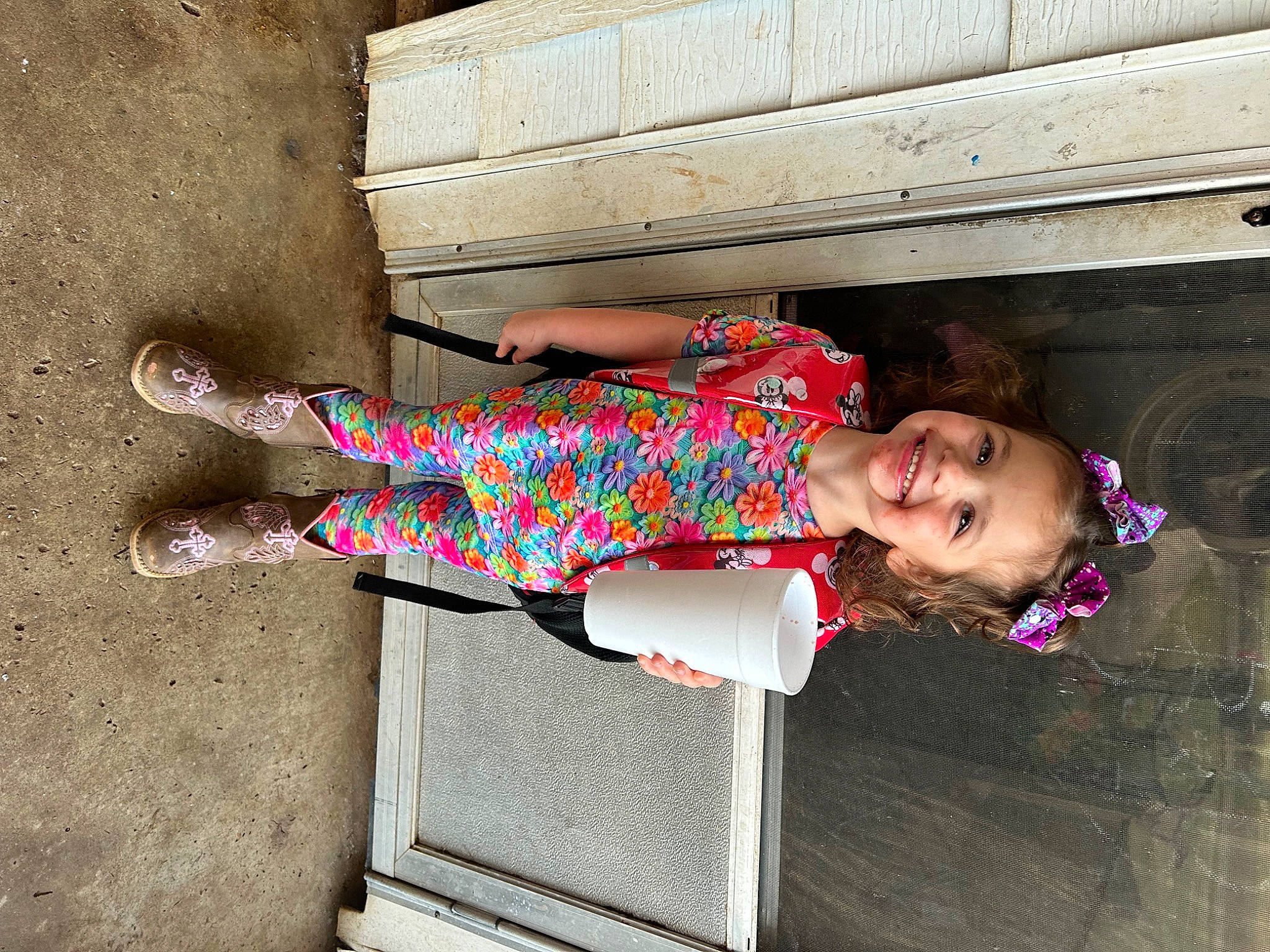 Nova is registered to the contest to win money with this photo: baby_toddler_clothing, child, concrete, foot, fun, happy, human_leg, joy, leisure, magenta, pattern, person, pink, sandal, sidewalk, sitting, smile, thigh, tints_and_shades, toddler