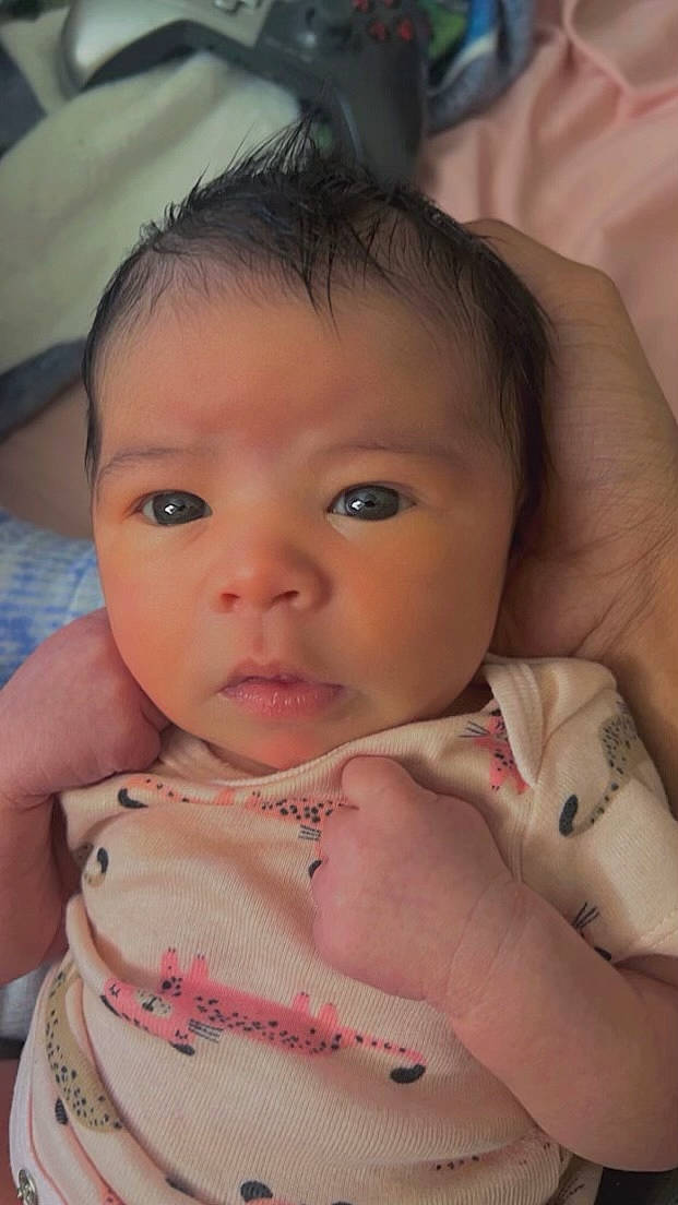 Kaydence is registered to the contest to win money with this photo: baby, baby_toddler_clothing, cheek, chin, ear, eye, eyebrow, eyelash, finger, forehead, gesture, hand, human_body, iris, lip, mouth, neck, nose, organ, person