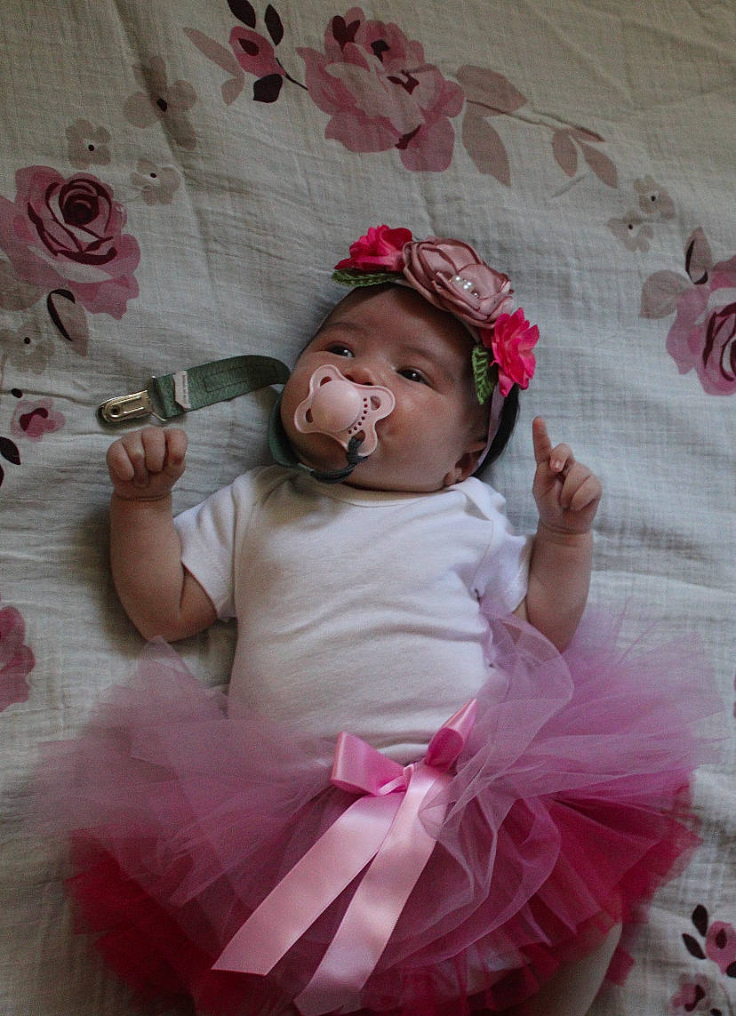 Kaydence joined the competition — help win amazing prizes! arm, baby, baby_toddler_clothing, child, costume, embellishment, fashion_accessory, hair_accessory, happy, headband, headgear, headpiece, linens, lip, magenta, person, petal, pink, skin, textile