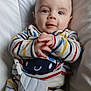 Samson a rejoint le concours — aidez-le/la à gagner de superbes lots ! baby, blue_eyes, child, closeup, clothing, comfort, cushion, cute, expression, face, hands, indoor, infant, person, portrait, seat, sitting, smile, striped_clothing, young_child