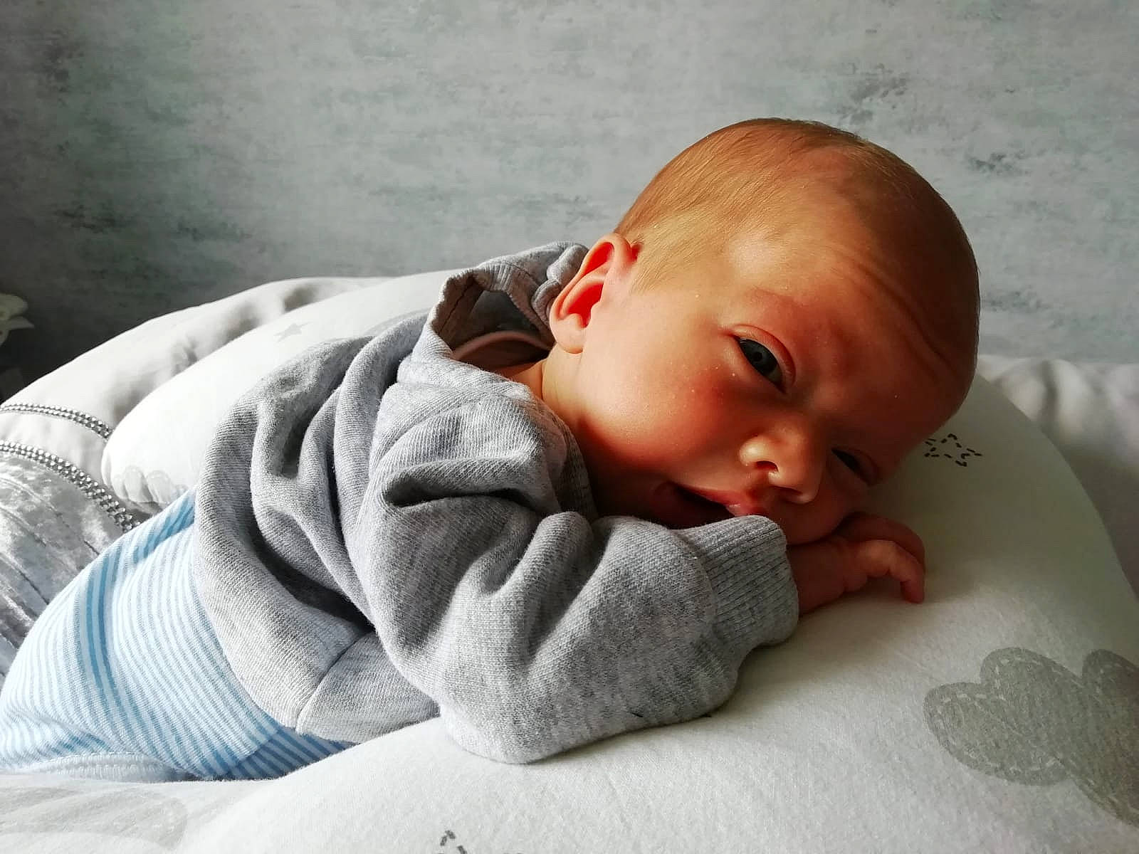 Mckenzie joined the competition — help win amazing prizes! arm, baby, baby_toddler_clothing, bedding, bedtime, cheek, child, chin, comfort, flooring, hand, linens, nose, pattern, person, room, sitting, skin, sleeve, toddler