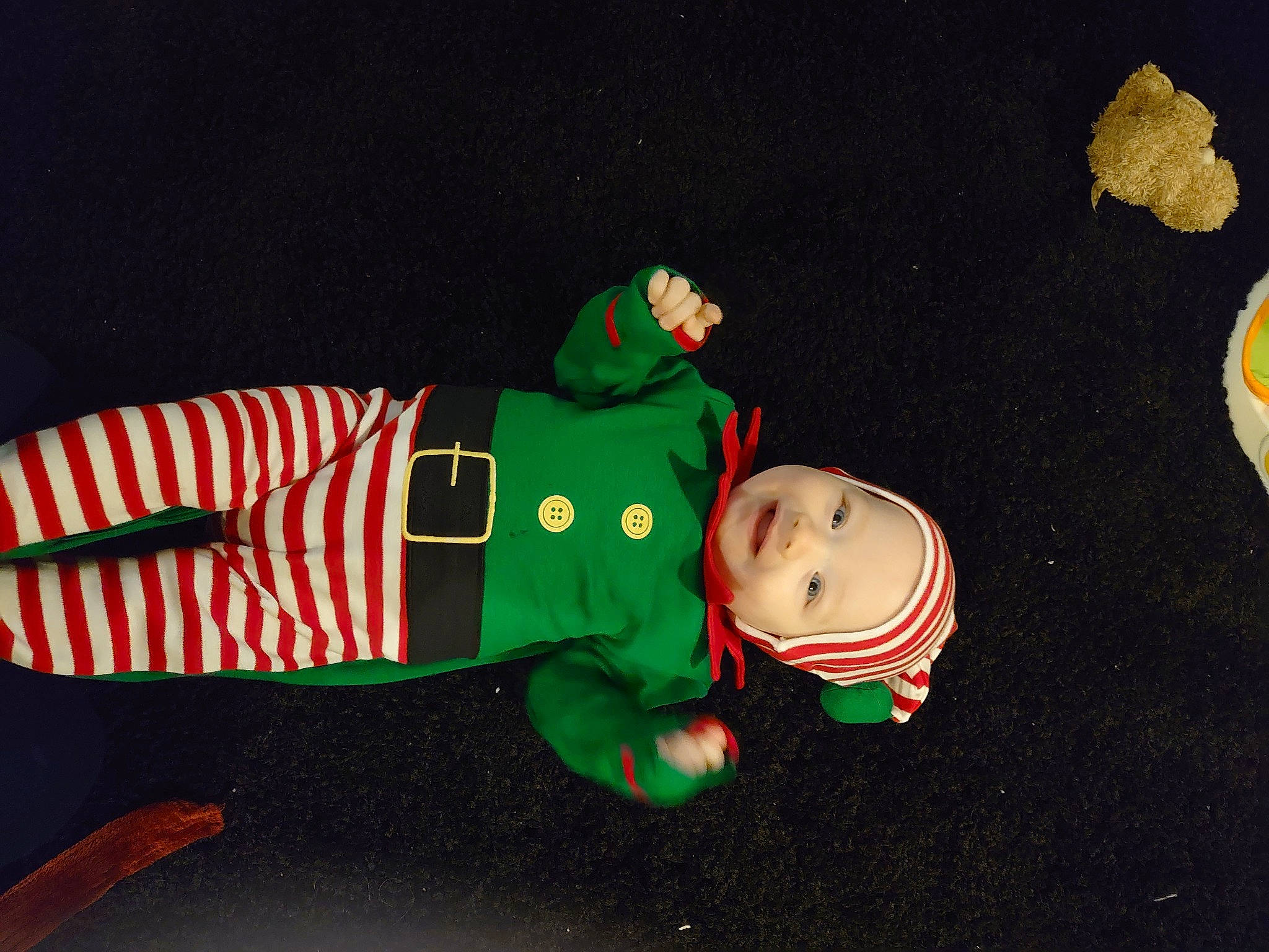 Mckenzie joined the competition — help win amazing prizes! baby, baby_toddler_clothing, carmine, child, christmas, christmas_decoration, christmas_eve, costume, costume_hat, event, fictional_character, hat, headwear, holiday, person, sleeve, toddler