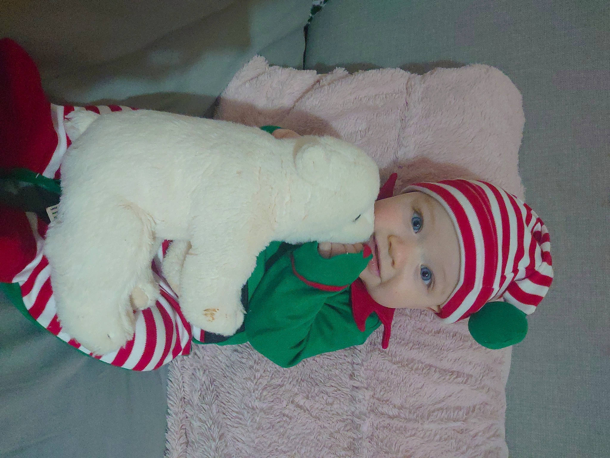 Mckenzie joined the competition — help win amazing prizes! baby, baby_toddler_clothing, carmine, child, christmas, christmas_eve, comfort, event, eye, fictional_character, hat, head, headwear, holiday, human_body, lap, person, smile, stuffed_toy, textile
