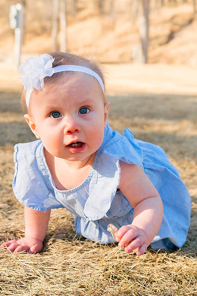 Adalynn is registered to the contest to win money with this photo: baby, baby_toddler_clothing, blond, child, eye, flash_photography, fun, grass, happy, hat, iris, landscape, people_in_nature, person, recreation, sitting, skin, soil, sun_hat, surprise