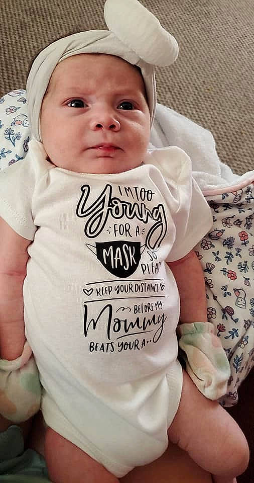 Adalynn is registered to the contest to win money with this photo: arm, baby, baby_toddler_clothing, cap, cheek, child, chin, cool, face, facial_expression, font, hairstyle, happy, head, headwear, neck, person, sleeve, smile, t_shirt