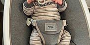 Grayson is registered to the contest to win money with this photo: baby, baby_buckle, baby_gear, baby_seat, child, clothing, comfort, cushion, cute, gray_hat, headwear, indoor, infant, newborn, onesie, pacifier, person, resting, seat, striped_clothing