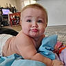 Dean is registered to the contest to win money with this photo: baby, blanket, blue, carpet, child, colorful, cute, diaper, expression, floor, furniture, home, indoor, infant, living_room, person, playtime, pout, soft, toy