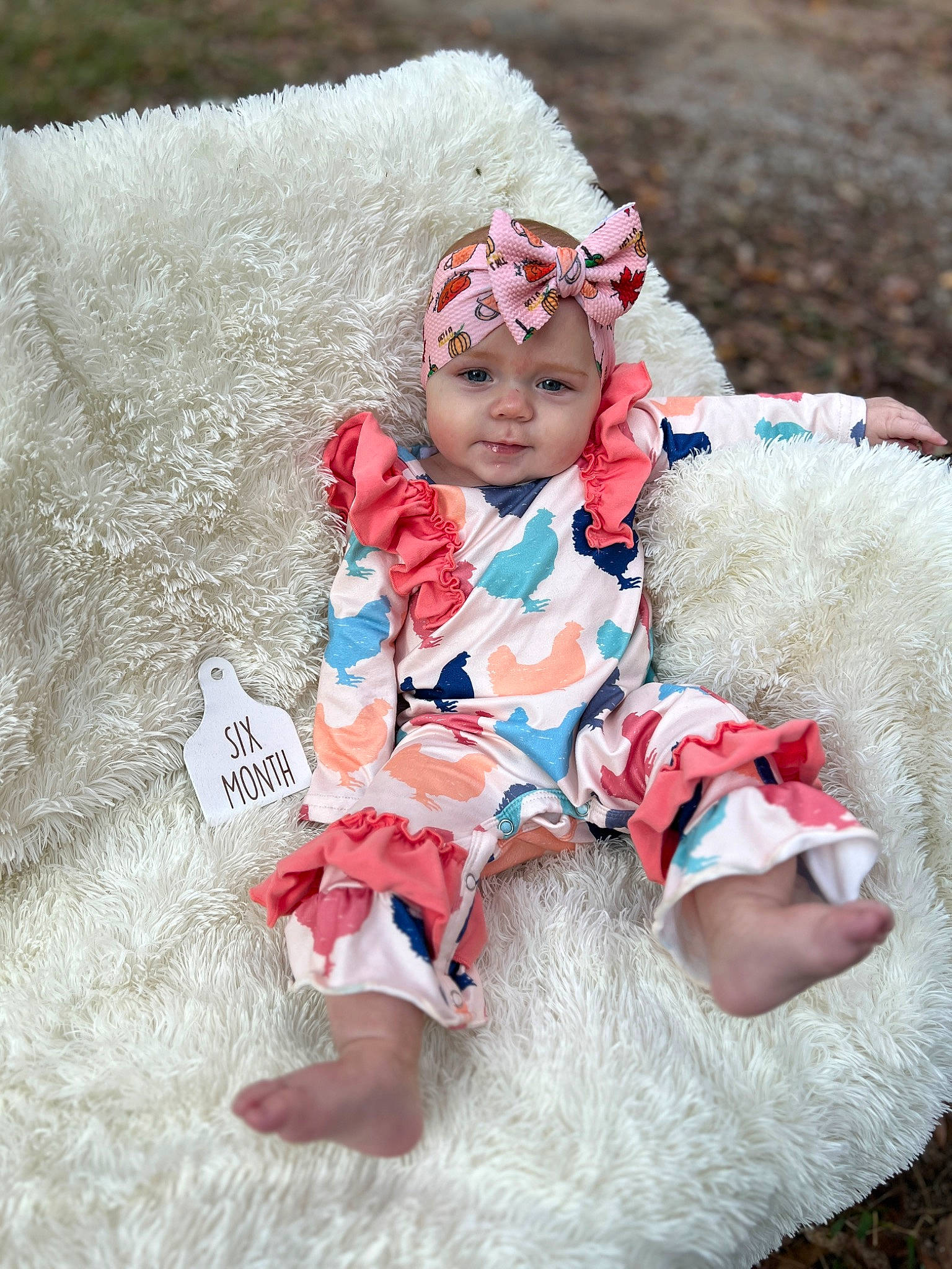 Remington is registered to the contest to win money with this photo: baby, baby_toddler_clothing, child, costume, embellishment, eye, fashion_accessory, fictional_character, fun, fur, grass, happy, headband, headpiece, headwear, person, pink, recreation, sitting, sleeve