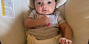 Cleo joined the competition — help win amazing prizes! baby, infant, baby_seat, cushion, onesie, pink_sock, hand, face, eyes, hair, blanket, clothing, indoor, child, person, newborn, cute, comfortable, seatbelt, soft