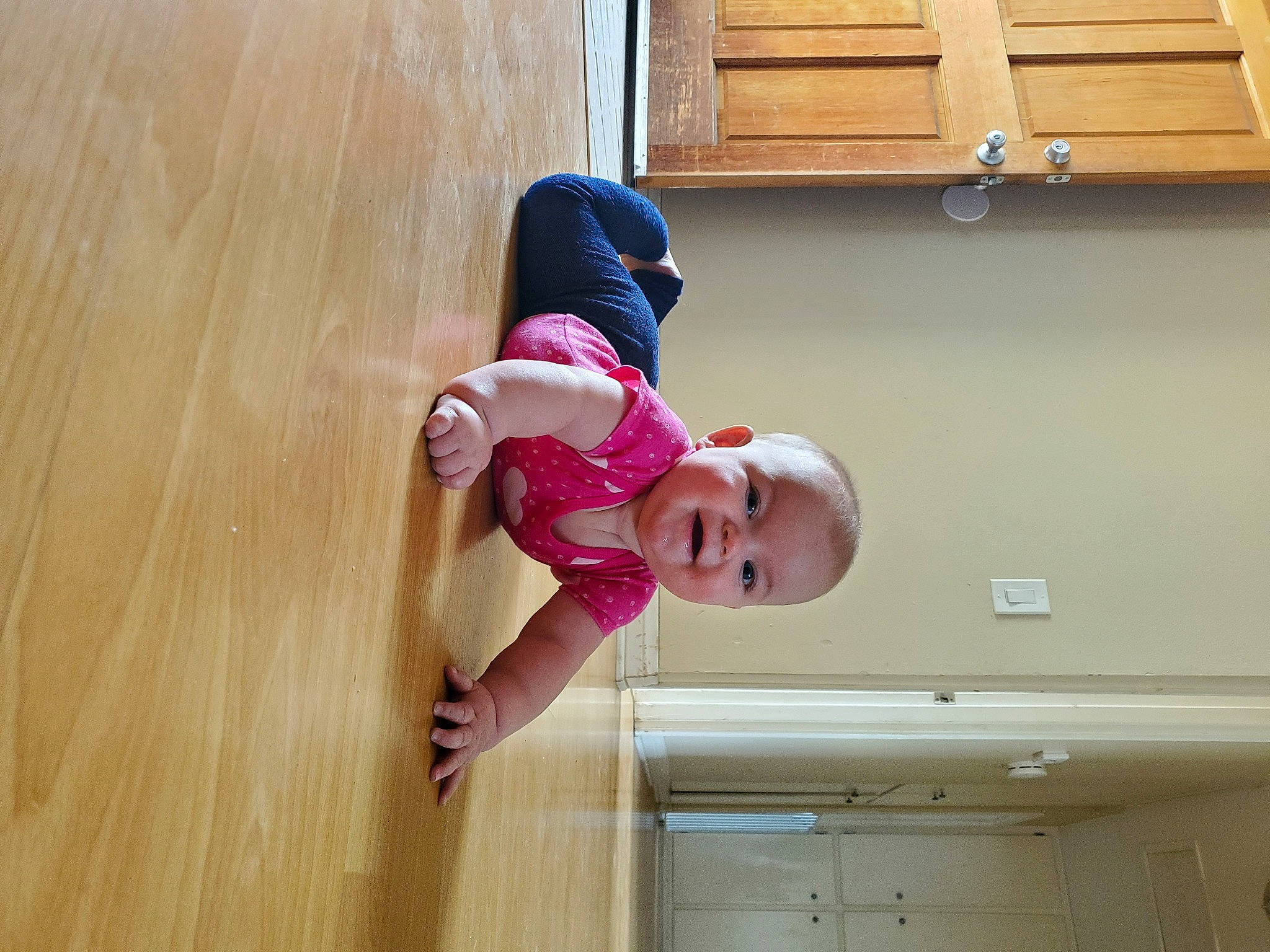 Paisley is registered to the contest to win money with this photo: baby, baby_toddler_clothing, child, elbow, floor, flooring, happy, hardwood, hat, laminate_flooring, leisure, magenta, person, sleeve, thigh, toddler, varnish, window, wood, wood_flooring