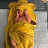 Ahmed joined the competition — help win amazing prizes! baby, towel, yellow, infant, blanket, bed, blue, pillow, cute, newborn, skin, hand, foot, sleeping, soft, cozy, indoors, child, covering_face, resting