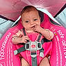 Sadie Faye is registered to the contest to win money with this photo: baby, infant, pink, baby_float, water, child, wet_hair, sitting, straps, canopy, outdoor, closeup, cute, chewing, blue_eyes, skin, summer, safety, portrait, relaxing