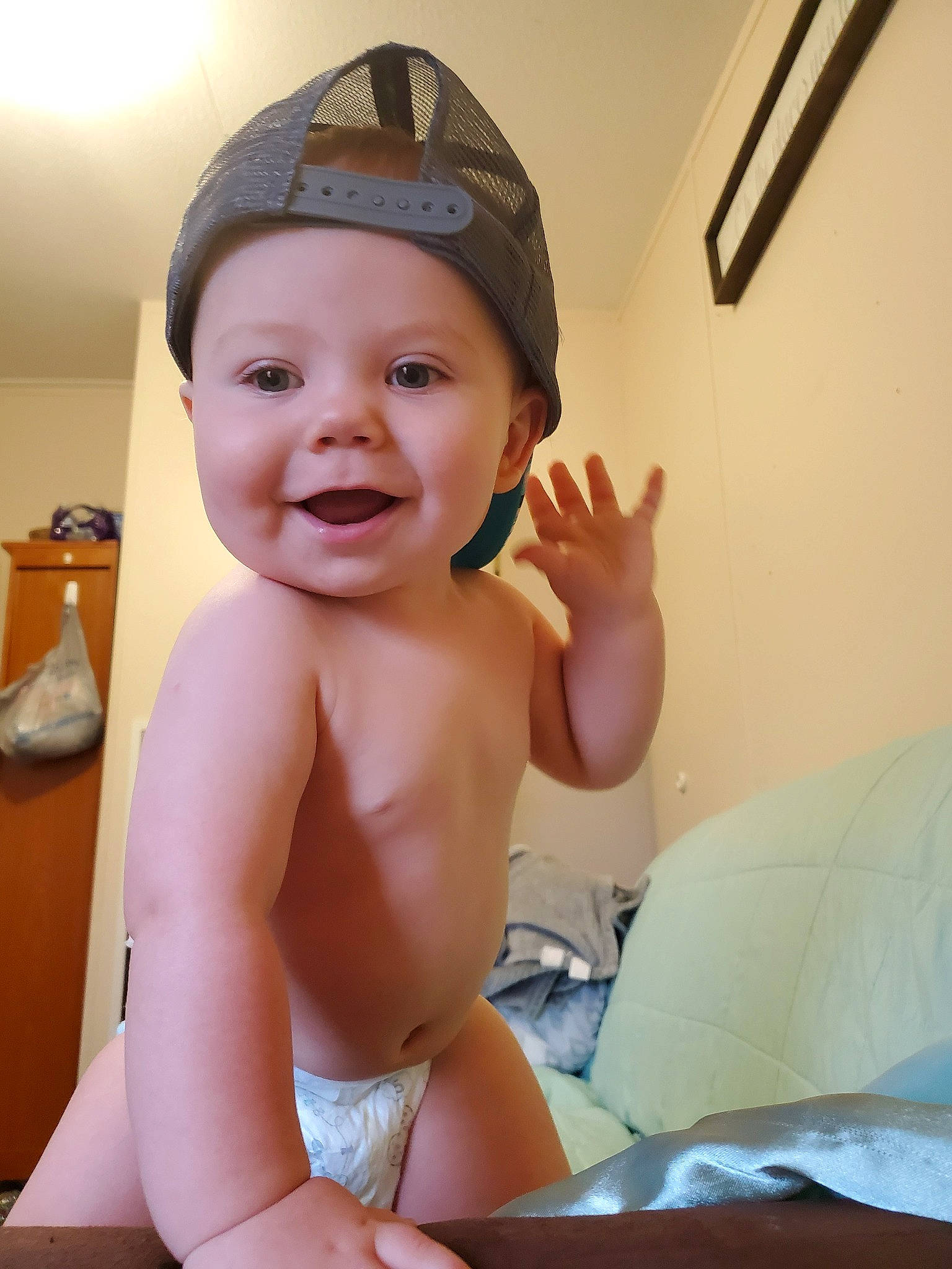 Zachariah is registered to the contest to win money with this photo: baby, child, finger, headgear, headwear, person, skin, smile, thumb, toddler