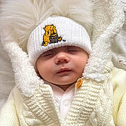 Aleksandra is registered to the contest to win money with this photo: baby, sleeping, white_hat, winnie_the_pooh, knitted_coat, fluffy, cute, infant, warm_clothing, closeup, soft_texture, peaceful, child, portrait, indoors, adorable, newborn, button, winter_wear, face