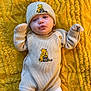 Aleksandra joined the competition — help win amazing prizes! adorable, baby, baby_clothes, child, cozy, cute, cute_expression, hat, indoor, infant, knitwear, lying_down, mittens, playful, portrait, smiling_face, soft_texture, toddler, warm_clothing, yellow_blanket