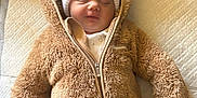 Aleksandra joined the competition — help win amazing prizes! baby, sleeping, hat, pom_poms, fluffy_clothing, brown_onesie, quilted_blanket, cozy, infant, cute, warm_clothing, child, indoor, soft_texture, peaceful, headwear, newborn, portrait, resting, adorable