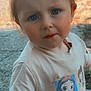 blue_eyes, cartoon, casual_clothing, child, curious, dirt, expression, face, hair, messy, nature, necklace, outdoor, person, princess, short_sleeves, sunlight, toddler, tshirt, young_child