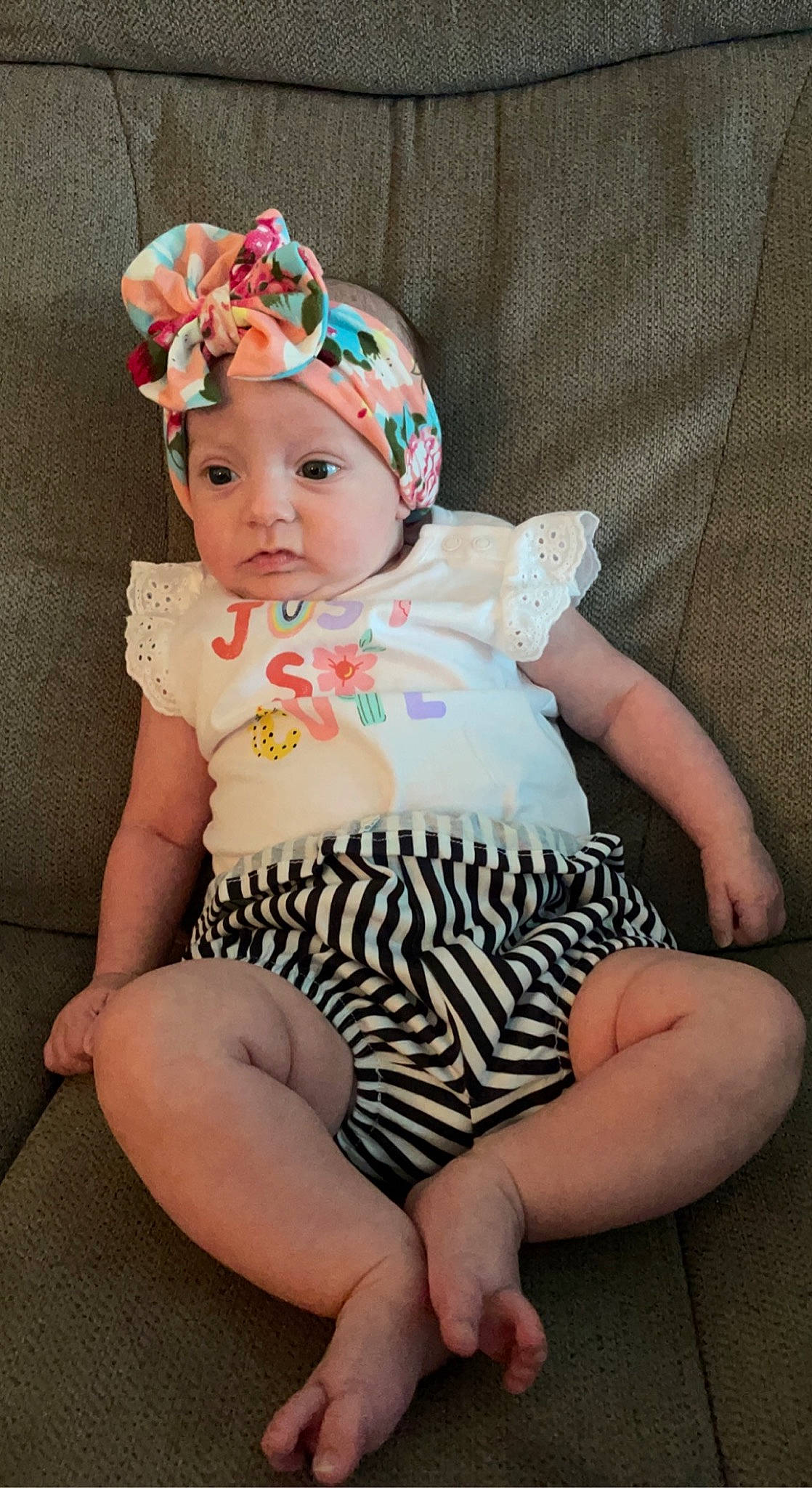 Madilynn is registered to the contest to win money with this photo: baby, baby_toddler_clothing, eye, face, finger, goggles, hand, head, headband, headgear, headpiece, headwear, human_body, iris, lip, pattern, person, pink, skin, sleeve