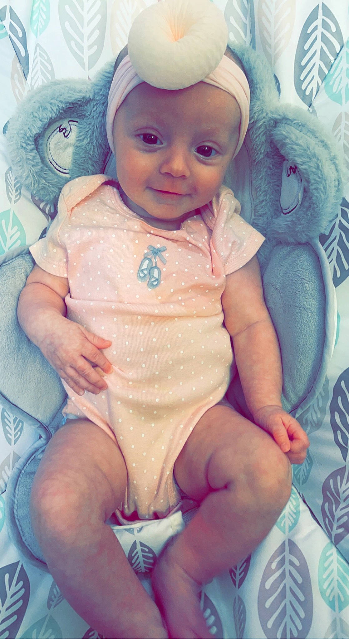 Madilynn is registered to the contest to win money with this photo: baby, baby_products, baby_toddler_clothing, blue, cheek, chest, child, doll, eyelash, happy, head, headwear, iris, linens, lip, person, pink, purple, skin, sleeve