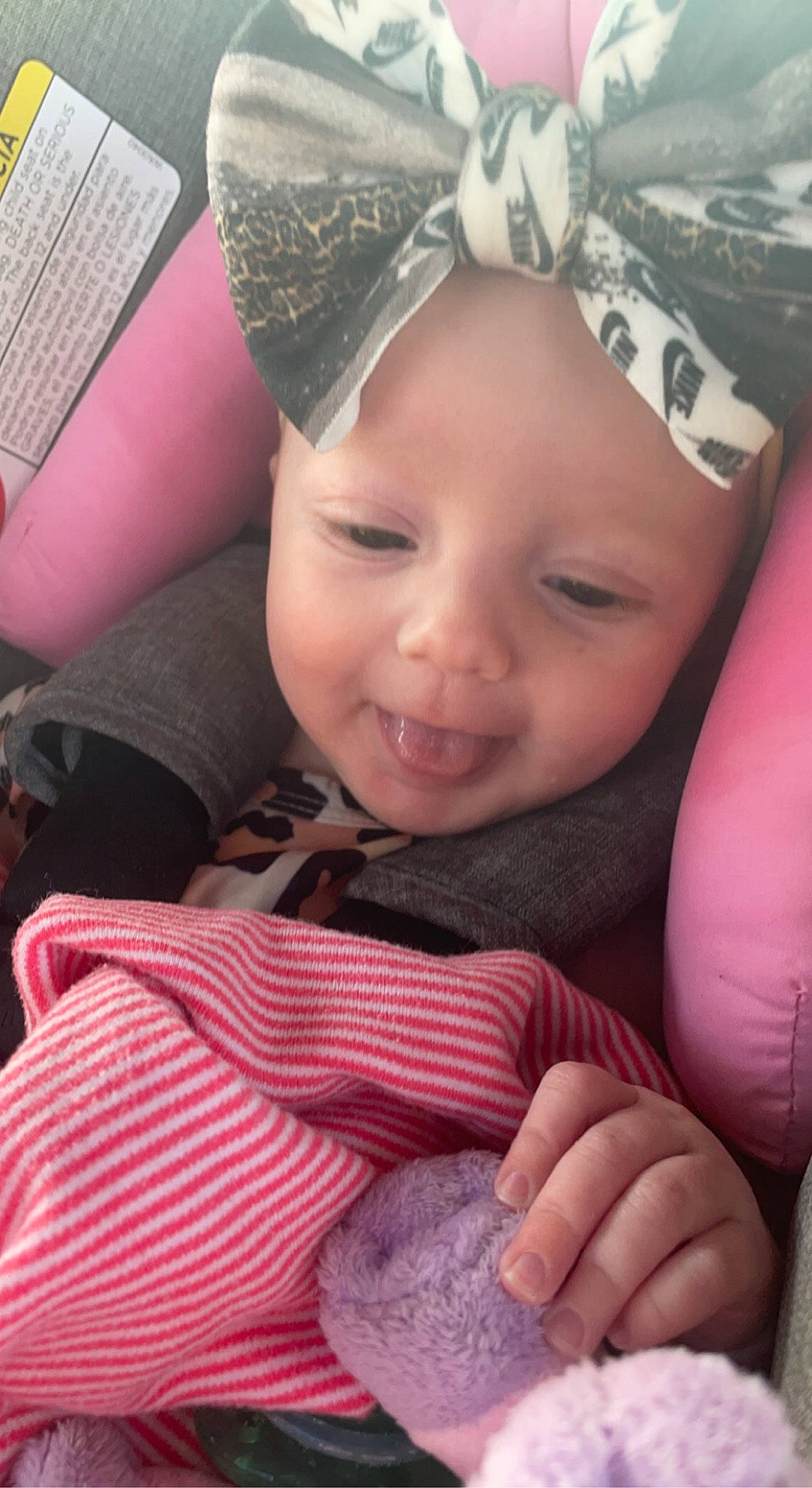 Madilynn is registered to the contest to win money with this photo: baby_toddler_clothing, cap, cheek, chin, eye, eyebrow, face, facial_expression, finger, gesture, happy, head, headwear, iris, lip, mouth, organ, person, pink, skin