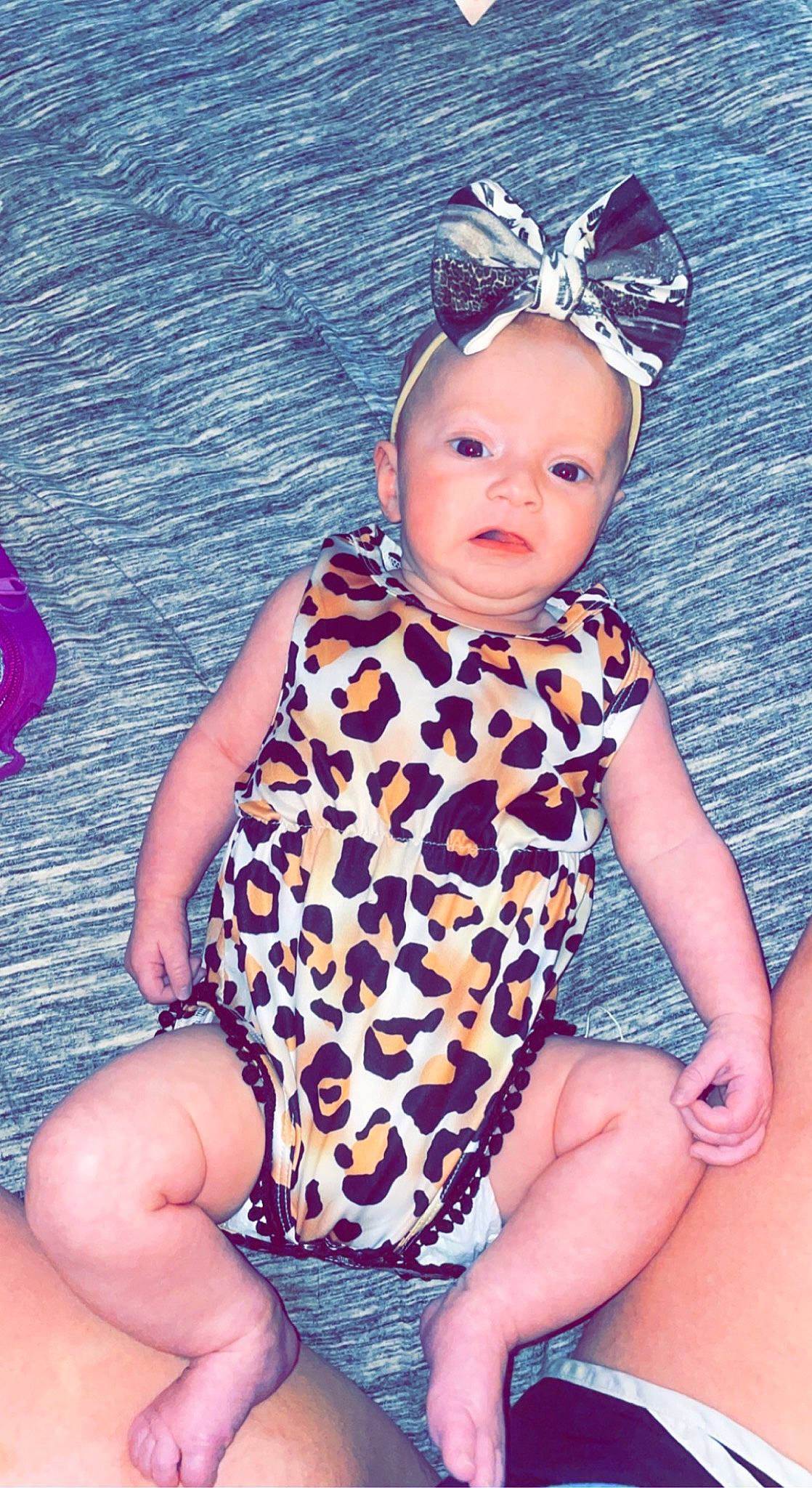 Madilynn is registered to the contest to win money with this photo: baby, baby_toddler_clothing, beauty, child, cool, electric_blue, eye, face, fun, happy, head, human_leg, magenta, pattern, person, pink, purple, skin, sleeve, thigh