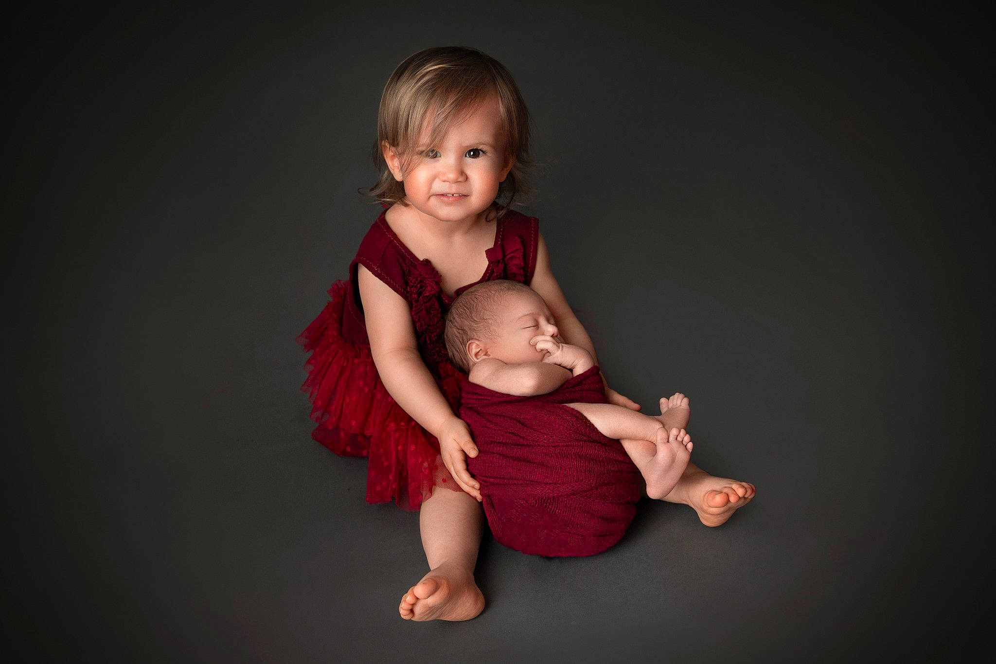 Nessa Joy participe au concours pour gagner de l'argent avec cette photo : baby, baby_toddler_clothing, barefoot, cheek, comfort, event, face, flash_photography, foot, fun, gesture, happy, one_piece_garment, person, shoulder, sitting, sleeve, smile, t_shirt, thumb