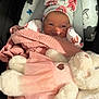 Rylee is registered to the contest to win money with this photo: baby, newborn, blanket, hat, bunny_ears, cushion, infant, plush_toy, teddy_bear, pink, smile, cute, soft_toy, baby_seat, indoors, headwear, wrapped, child, young, adorable