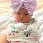 Rylee joined the competition — help win amazing prizes! newborn, baby, infant, wrapped, blanket, handprint, bow, hat, pastel, striped, face, sleepy, soft_light, cute, portrait, indoors, person, child, cozy, toddler