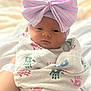 newborn, baby, infant, wrapped, blanket, handprint, bow, hat, pastel, striped, face, sleepy, soft_light, cute, portrait, indoors, person, child, cozy, toddler